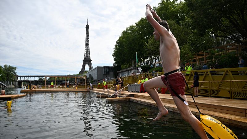 Parisians Return To Seine Swimming After Century-Long Ban Parisians Return To Seine Swimming After Century-Long Ban